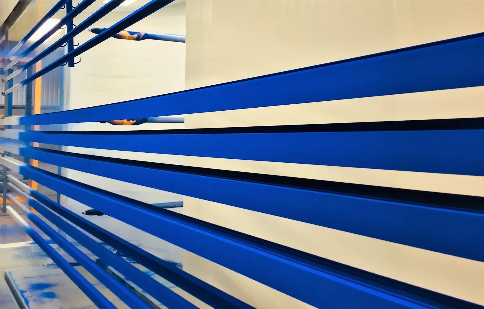 Blue architectural aluminium profiles moving through Swallow's Elland production facility